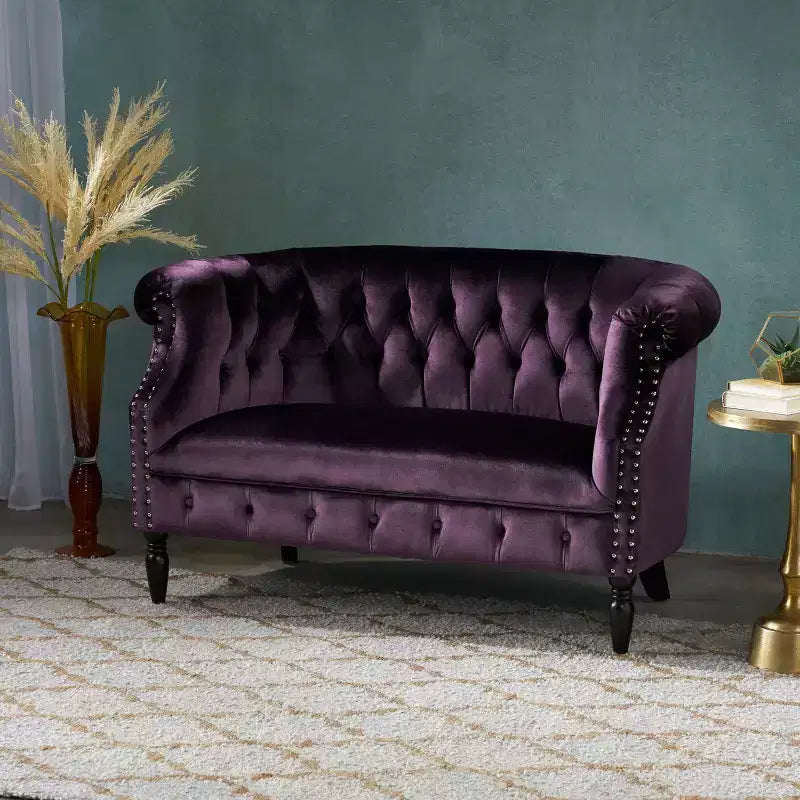 Divanetto 2 posti capitonné con braccioli arrotolati nei colori mora / smeraldo / blu navy