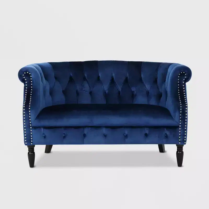 Divanetto 2 posti capitonné con braccioli arrotolati nei colori mora / smeraldo / blu navy